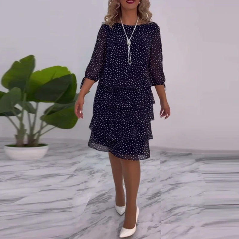 Elegantes Kleid mit Polka-Dot-Muster und Schichten