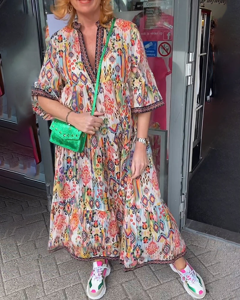 Elegantes langes Kleid mit V-Ausschnitt und Druck