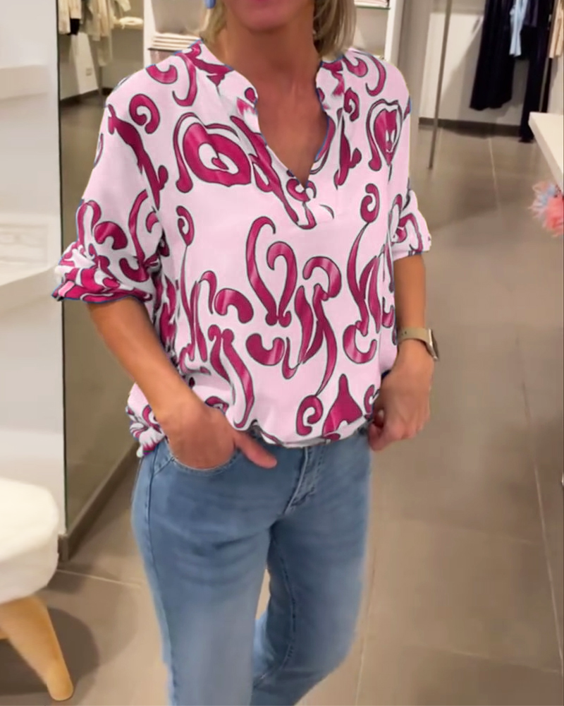 Elegantes langärmliges Oberteil mit bedrucktem V-Ausschnitt