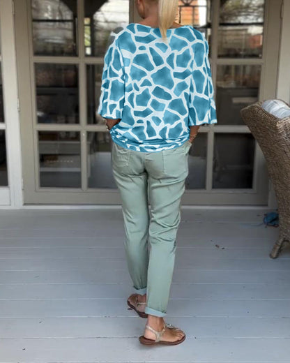 Elegante bedruckte Bluse mit V-Ausschnitt und Fledermausärmeln